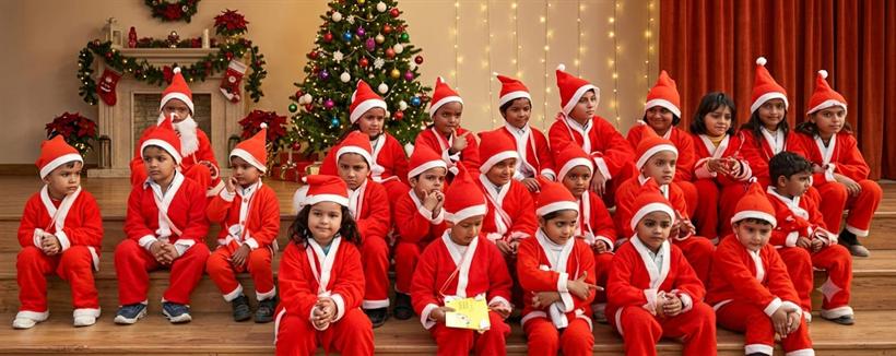 Students dressed as Santa for Christmas